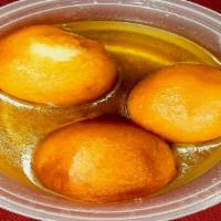 Gulab Jamun · Golden fried milk balls in rose flavored syrup.