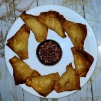 Krab Wontons · With a spicy dipping sauce.