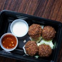 Falafel Snack · Spicy. Four falafel patties. Served with warm pita bread, white sauce and spicy red sauce co...