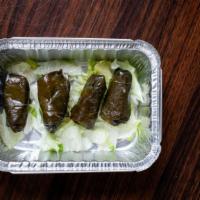 Dolma Grape Leaves · Four grape leaves stuffed with vegetables and rice wrapped in warm pita bread.