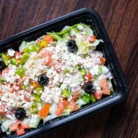The Greek Salad · Romaine lettuce, tomatoes, sliced cucumbers, red onion, feta cheese, peppers and olives with...