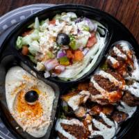 Veggie Plate · Falafel and hummus served on top of Mediterranean rice and a Greek feta and olive salad. Top...