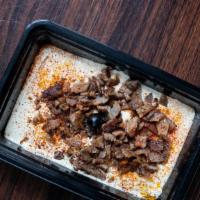 Hummus On Gyro · Fresh hummus with extra virgin olive oil and paprika topped with chicken and served with war...