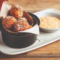 Mac & Cheese Bites · Award-winning bites made in our kitchen daily! Our spicy pepper jack Mac & Cheese hand-rolle...
