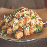 Loaded Taters · Beer-infused. Tater tots loaded with our Amber Ale beer cheese & topped with fresh jalapeños...
