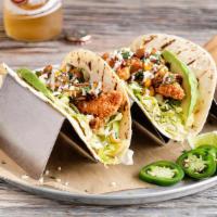 Street Tacos (2 Tacos) · Topped with freshly-made roasted tomato & corn salsa, shredded lettuce, avocado, fresh cilan...