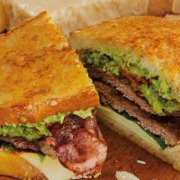 1/2 Parmesan-Crusted Sourdough Cheeseburger · Parmesan-crusted sourdough loaded with 1/2 lb. 100% USDA pure beef, hickory-smoked bacon, ch...