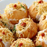 Sev Dahi Puri · Small crispy puffed breads stuffed with boiled potato, chick peas, sprouted beans and topped...