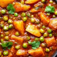 Aloo Matar  · Potatoes, peas  cooked in a special sauce