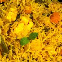 Veg Biryani · Layers of curry-spiced vegetables mixed with basmati rice served with yogurt