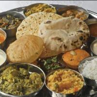 North Indian Thali · North Indian Thali (Roti/Puri, Rice, Pakoda Kadhi, Paneer, Rice, Chana Masala, Dal and mix v...