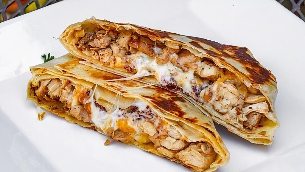 Quesadilla · Filled with Choice of Protein and Mexican cheese.
Served with salsas and sour cream.