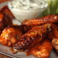 Wings · Colossal party wings, cooked tender and juicy, served with homemade bleu cheese dressing and...