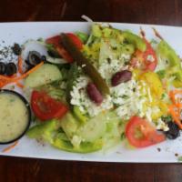 Greek Salad · Vegetarian. Lettuce, tomato, cucumbers, olives, onions, feta cheese, greek dressing or cream...