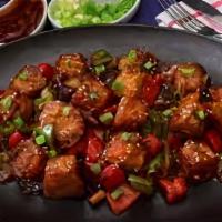 Crispy Chilli Paneer · Soft crisped cottage cheese cubes smooth coated with indo chilli sauce.