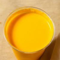 Mango Lassi · Mango lassi is made from yogurt, milk, mango pulp and sugar.