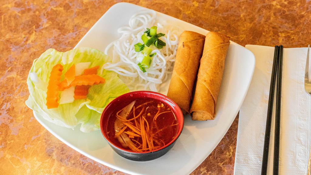 Crispy Spring Rolls · A savory mixture of ground pork, taro, carrots, onion, rice vermicelli, and mushroom wrapped in spring roll and fried golden brown. Served with 