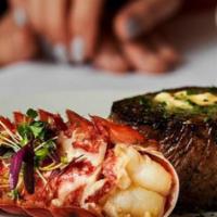 Petite Filet Mignon & Lobster Tail Scampi · Menu features our petite filet mignon paired with lobster tail, sautéed roasted campari toma...