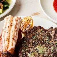 Prime Surf & Turf · Menu features 20 oz.prime bone-in ribeye & north atlantic lobster tail with drawn butter. In...