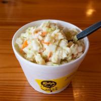 Coleslaw · Chopped green cabbage, and carrots, mixed with a sweet creamy slaw dressing.