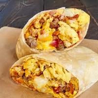 Meat Lover'S Breakfast Burrito · Scrambled eggs, bacon, sausage, ham, mushroom, breakfast potatoes and choice of cheese wrapp...