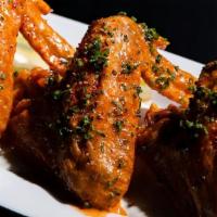 Confit Chicken Wings · Gluten Free. Cholula beurre monte, Michelin star ranch, celery.