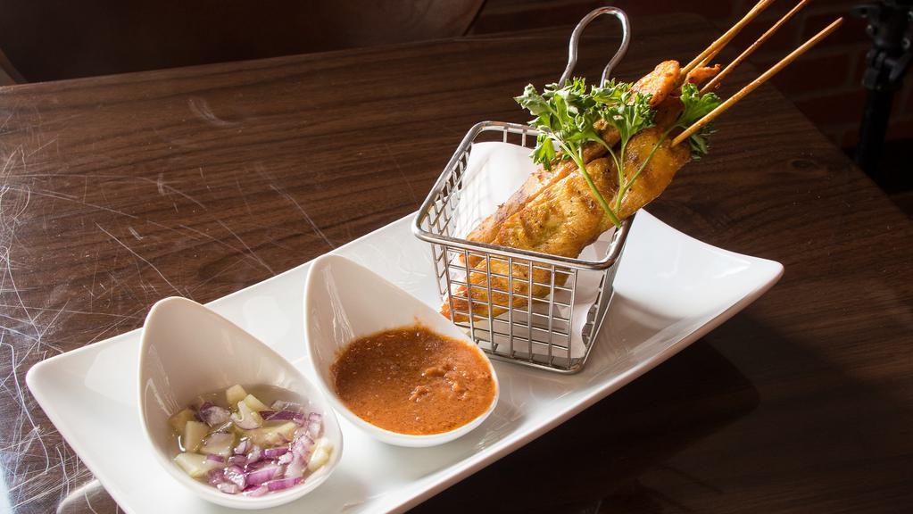 A 12. Chicken Satay (4) · Grilled marinated chicken with yellow curry powder on skewers served with peanut sauce.