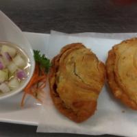 A 7. Vegetable Curry Puff (2) · Potato, carrot, white onion, wrapped with flaggy puff served with cucumber sauce.