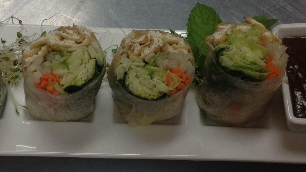 A 4. Tofu Summer Roll (2) · Tofu, lettuce, carrot, bean sprout, red cabbage, mint, cilantro, basil wrapped with delicate rice wrapper served with summer roll sauce.