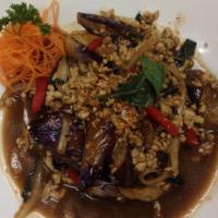 E 9. Pad Spicy Eggplant · Stir-fried Chinese eggplant, onion, bell pepper, carrot, basil in sweet chili paste.