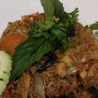 E 20. Pad Kapow Fried Rice · Stir fried onion, bell pepper, string bean, carrot and basil in Kapow sauce with cucumber sl...