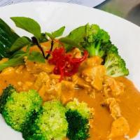 E-16 Panang Curry · Panang curry chili paste with coconut milk, basil topped with kaffir lime leaf, steam brocco...