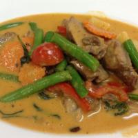 E 27. Duck Curry · Spicy. Duck, pineapple, tomato, string bean, carrot, bell pepper, basil in coconut milk.