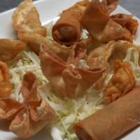 Combination Appetizers · Cream cheese wonton (4 pieces), egg roll (2 pieces), fried shrimps (4 pieces), chicken fried...