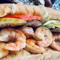 Fried Shrimp Po' Boy · The signature sandwich of New Orleans. Crispy fried shrimp on a sub roll with lettuce, tomat...