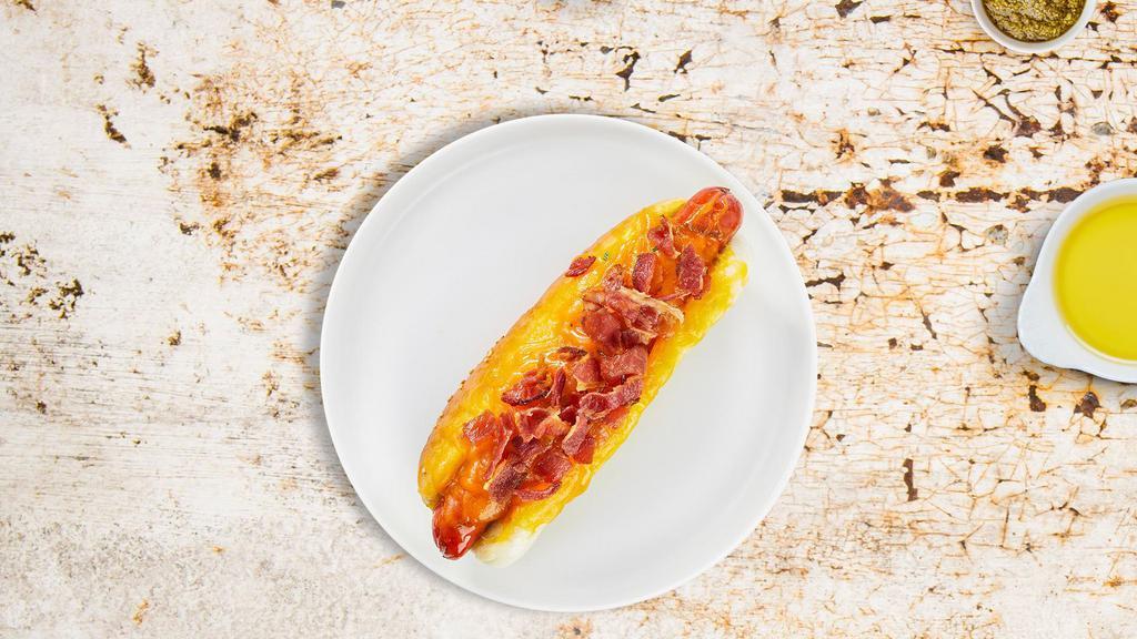 Dirty Bacon Cheese Hot Dog · Hot Dog with melted cheese and bacon.