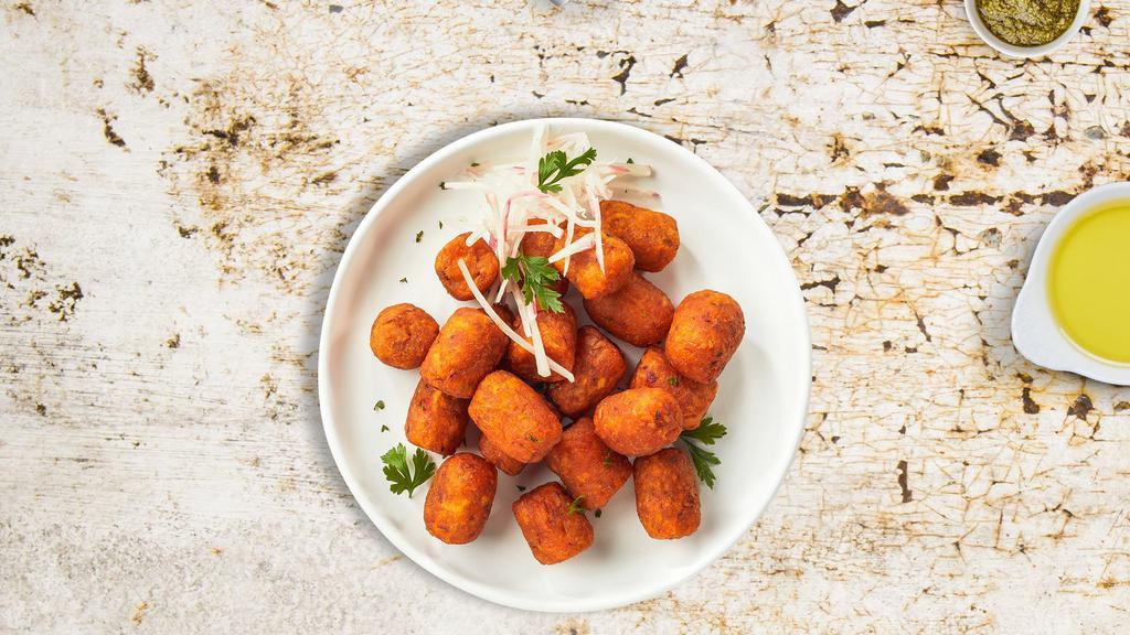 Food For Tots · Shredded sweet potatoes formed into tots, battered, and fried until golden brown. Served with your choice of sauce.