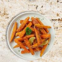 Freedom Sweet Potato Fries · Thick-cut sweet potato wedges fried until golden brown