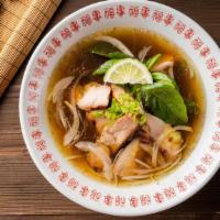 Chicken Phó Noodle Soup · Chopped grilled chicken. Served with chicken broth soup, onions, scallions, and lemon, basil...
