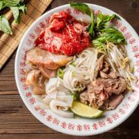 Phó Top Noodle Soup · Served with beef broth soup, rare eye round, cooked beef, beef tripe, beef tendon, onions, s...