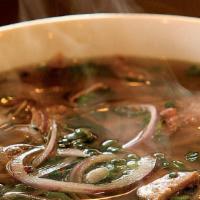 Fried Pork Cutlet Phó Noodle Soup · Fried pork cutlet. Served with beef broth soup, onions, scallions and lemon, basil and bean ...