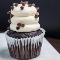 White Midnight Magic · Devil’s food cake baked with dark chocolate chips, topped with a white cream cheese frosting...