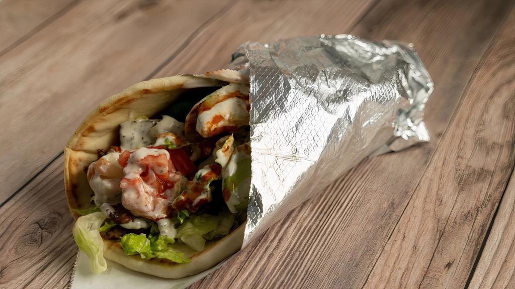 Gyro Wrap · lettuce, tomato, cucumber, pickle ,onion, feta cheese, white sauce, and red sauce