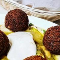 Hummus Falafel · OUR HOMEMADE DELICOUS HUMMUS TOPPED W/ 4 HOMEMADE FALAFEL BALLS,CHICKPEAS,TAHINI,SPICES,OLIV...