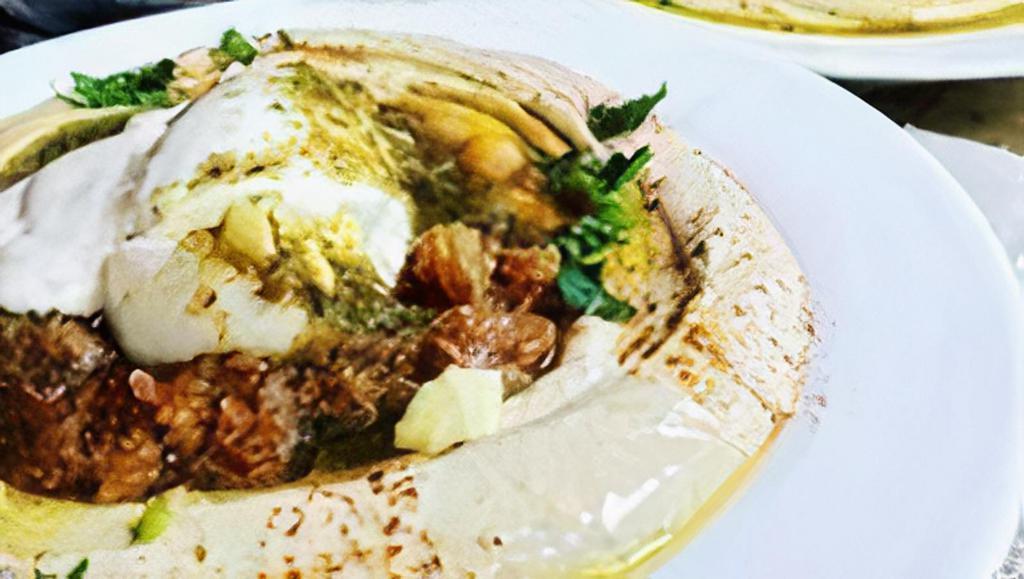 Hummus Sabich · OUR HOMEMADE DELICOUS HUMMUS TOPPED W/ EGGPLANTS,CHICKPEAS,HARD BOILED EGG,TAHINI,OLIVE OIL,SPICES, & LEMON JUICE SERVED W/ 2 PITA BREAD