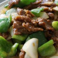 Pepper Steak · With white onions and bell peppers in a brown sauce.