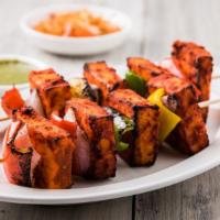 Paneer Tikka · Marinated Indian spice clay oven sautéed bell pepper and tomato, onion.