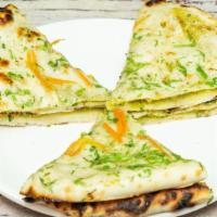 Aloo Kulcha · Paratha stuffed with mildly spiced mashed potatoes & peas.