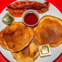 Pancakes · Three pancakes with your choice of two slices of bacon or sausage patties.