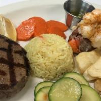 Surf & Turf · Lobster tail with grilled filet mignon. Served with potatoes and daily vegetable.